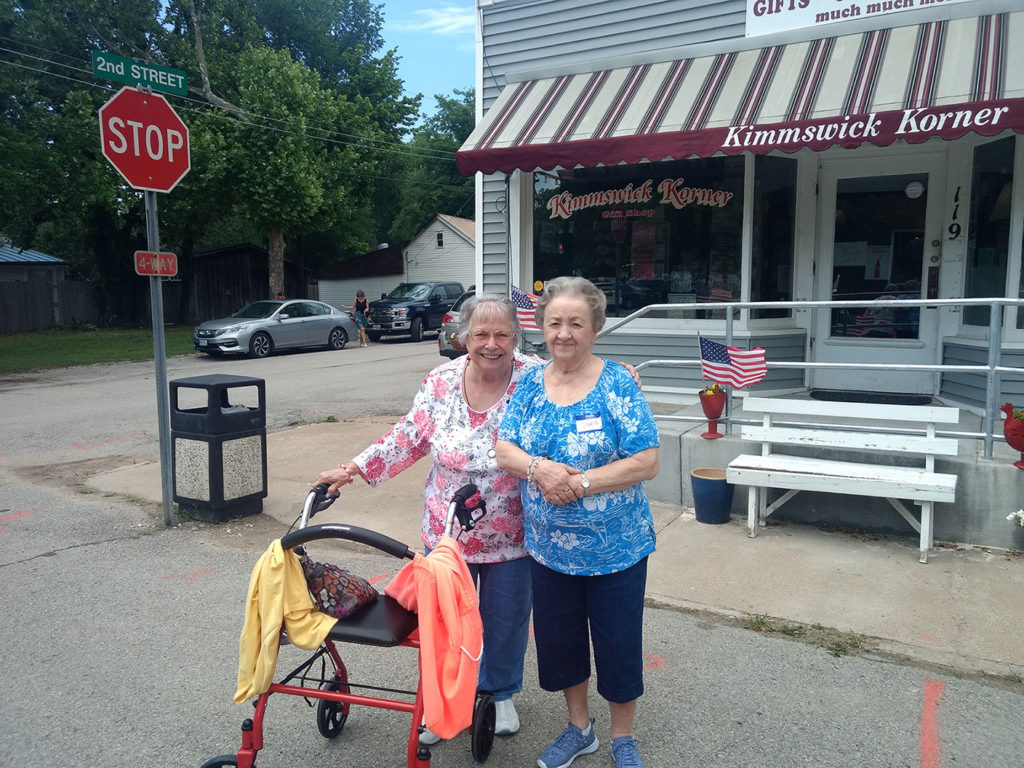 Lois and Diane, Wyndham Park residents, pose in front of Kimmswick Korner.