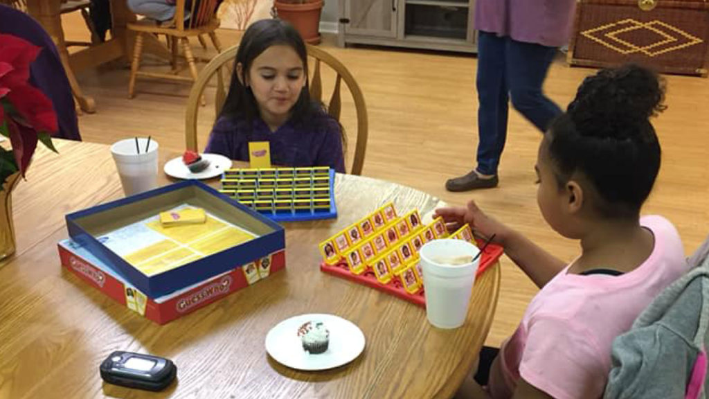 Residents of Portales Properties gathered together for game night in the community room on December 18, 2018.