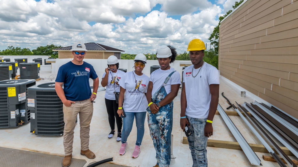 The Oasis of Vine City, Inc., a community development corporation of Higher Ground Empowerment Center Church, celebrated the halfway mark of the construction of The Legacy at Vine City with a Top Off Event.