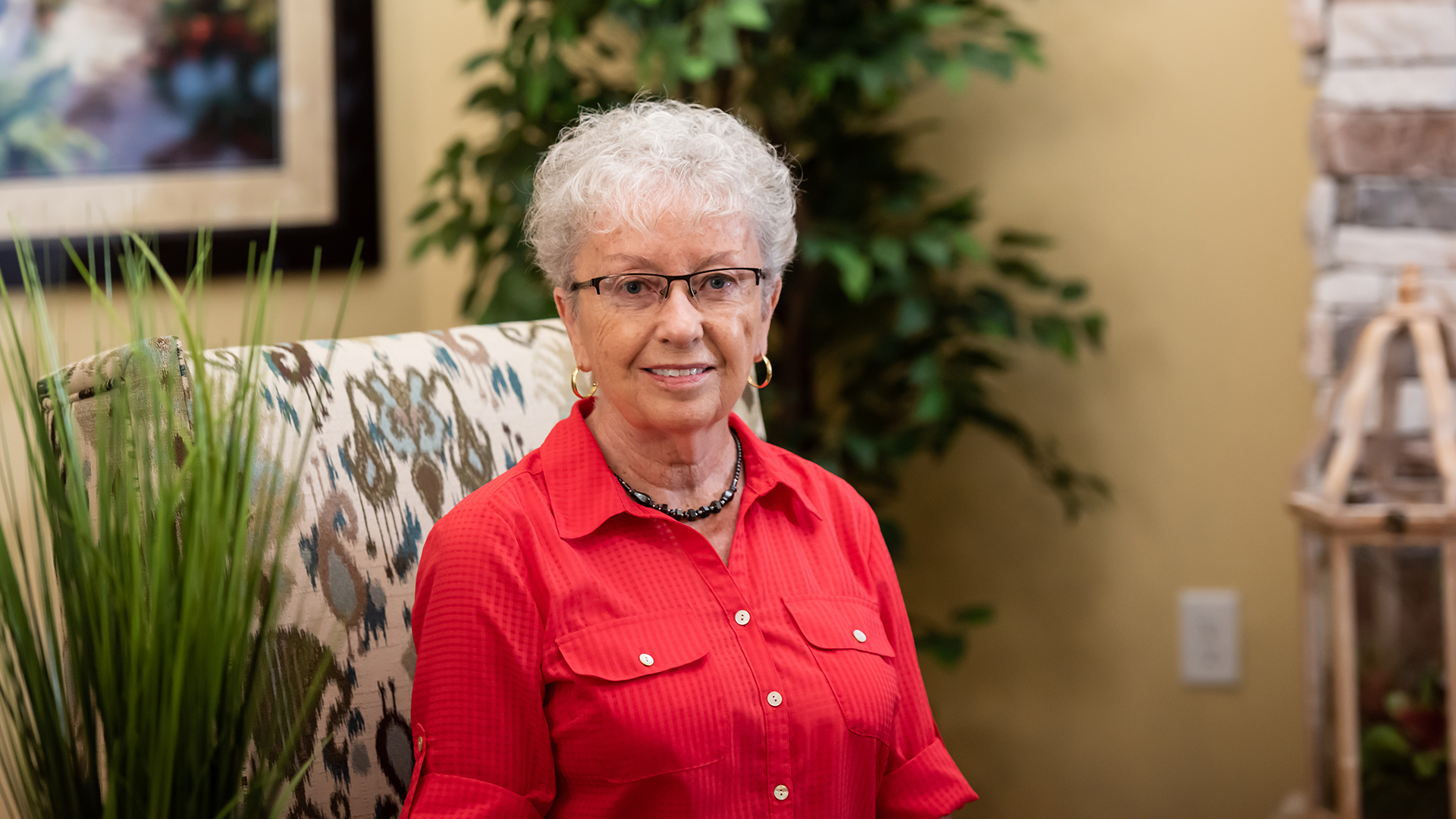 Barbara Froh relaxes in the community room at Wisteria Place.